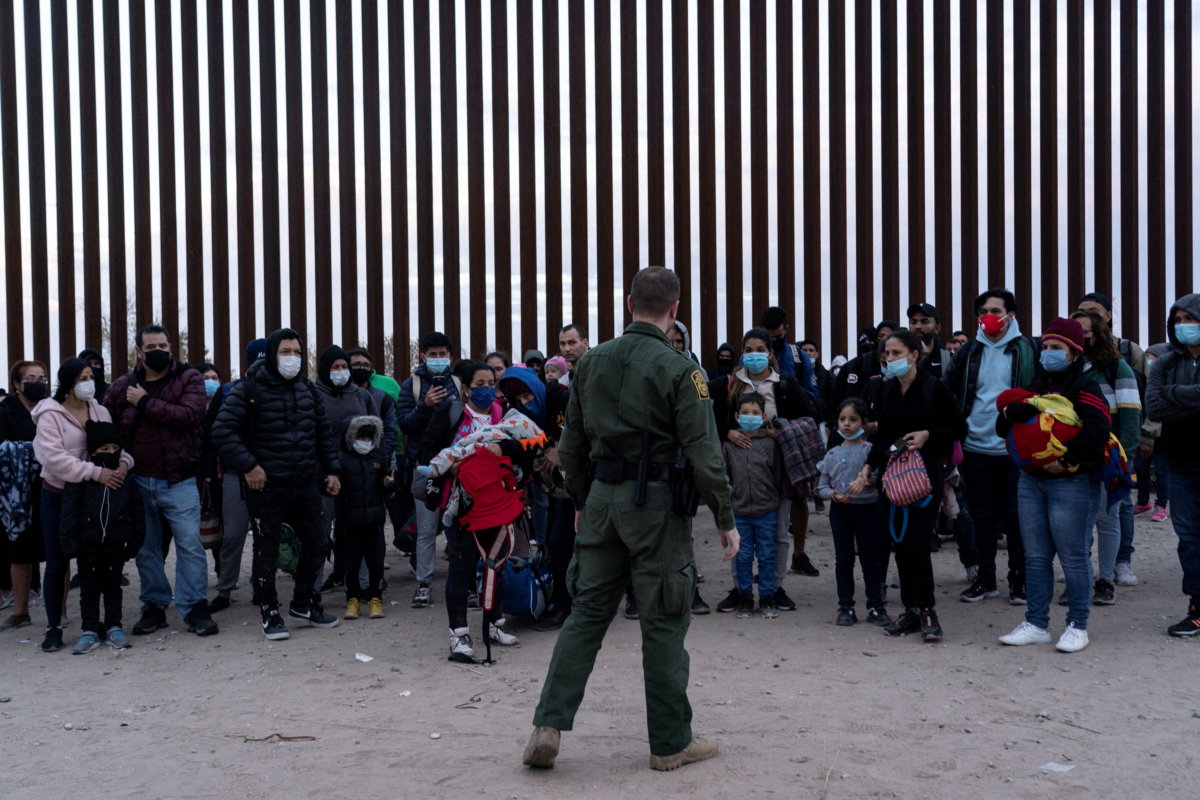 FILE PHOTO: Migrants cross the border in Yuma, Arizona