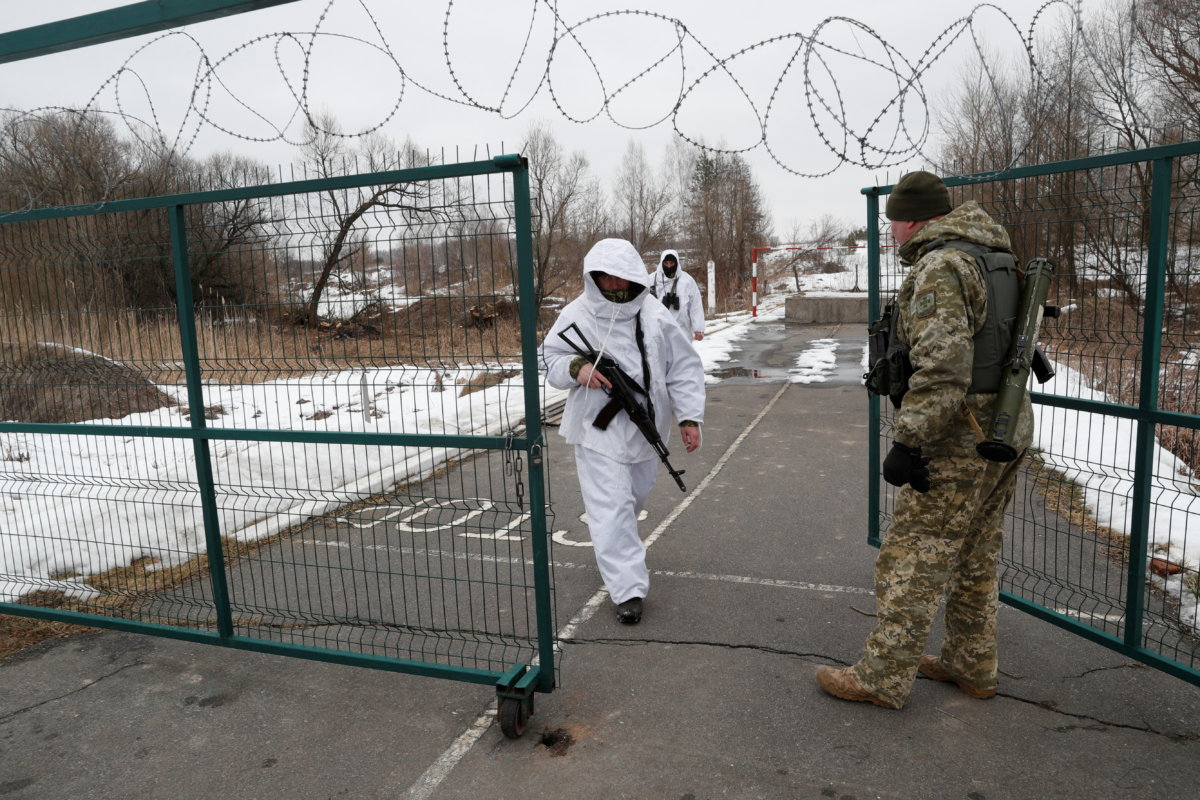 Ukrainian border guards keep watch on the frontier with Russia in Chernihiv region