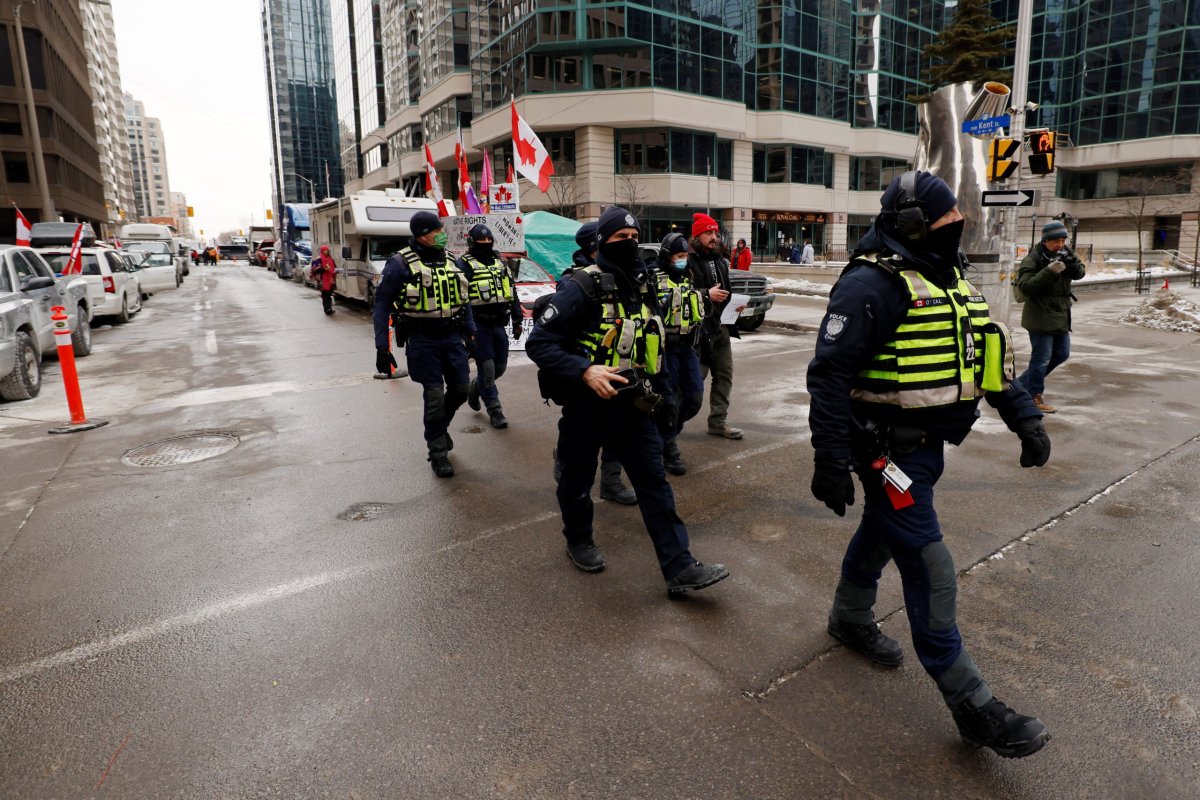 Police officers patrol downtown streets as truckers and supporters continue to protest coronavirus disease (COVID-19) vaccine mandates, in Ottawa