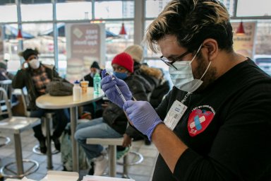 FILE PHOTO: People get COVID-19 vaccines and booster doses in Chicago