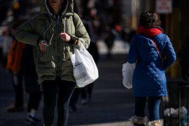 A shopper carries a plastic bag in the Manhattan borough of New York City