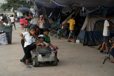 Asylum-seeking migrants live in a public square in Reynosa, Mexico