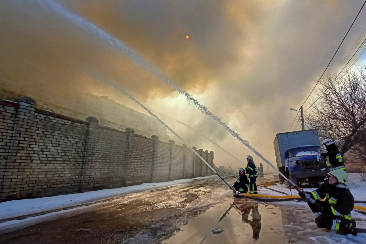 Warehouse storing products is seen on fire after shelling in Kharkiv