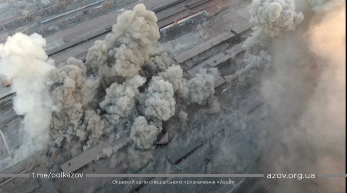Smoke rises around an industrial compound after multiple explosions, in Mariupol