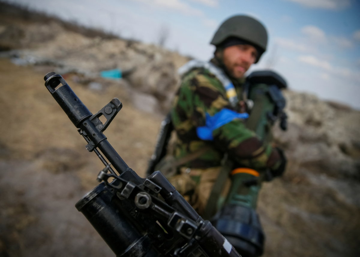 A Ukrainian service member stands at a position on the front line in the north Kyiv region
