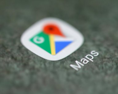 The Google Maps app logo is seen on a smartphone in this illustration