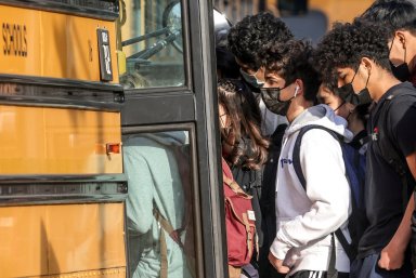 FILE PHOTO: Students leave Washington-Liberty High School in Arlington, Virginia