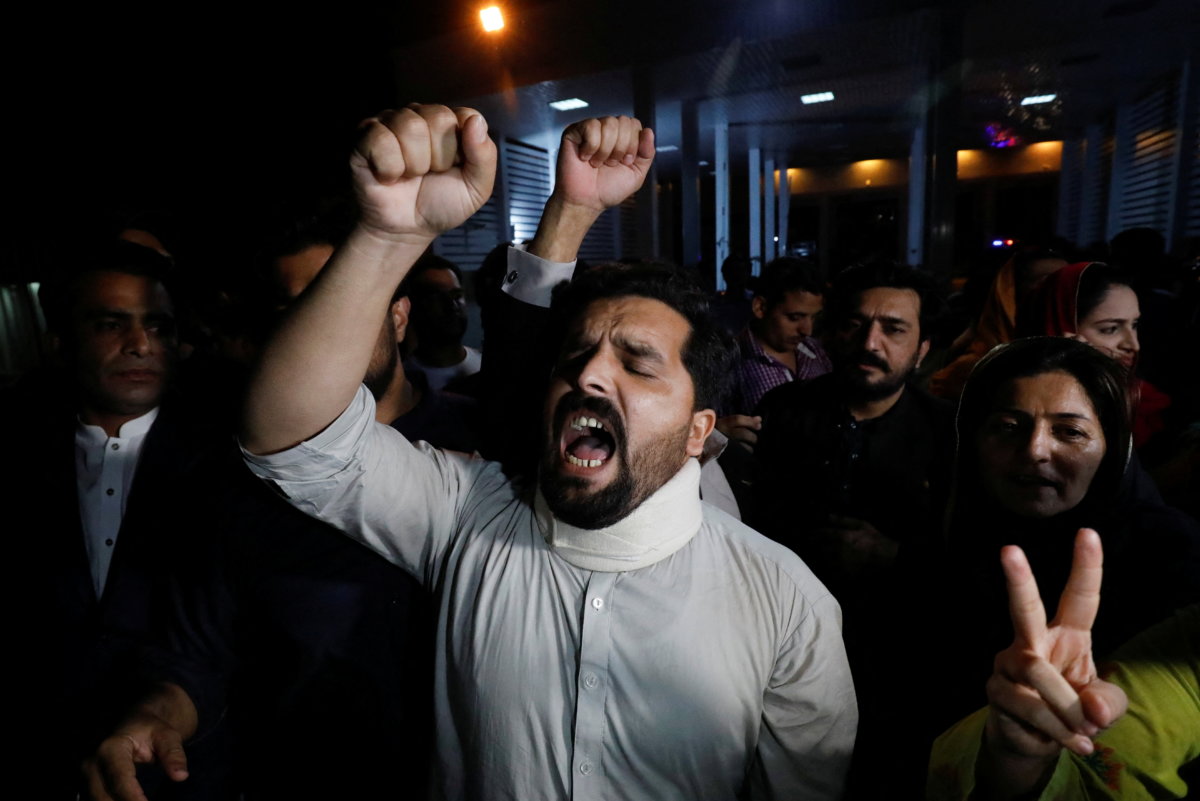 Supporters of former Pakistani Prime Minister Imran Khan chant slogans as they protest after he lost a confidence vote in the lower house of parliament, in Islamabad,