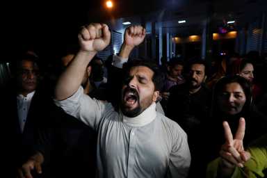 Supporters of former Pakistani Prime Minister Imran Khan chant slogans as they protest after he lost a confidence vote in the lower house of parliament, in Islamabad,