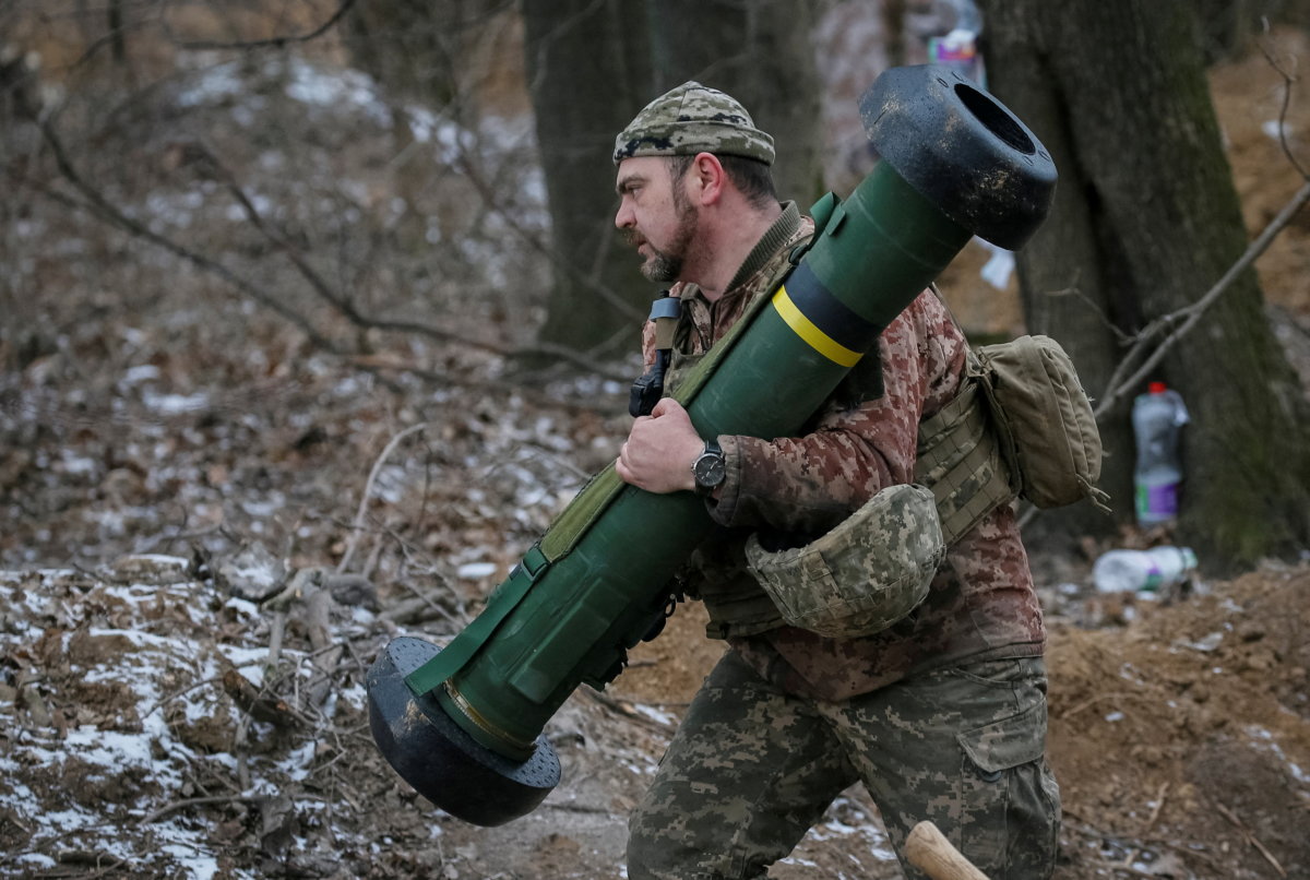 FILE PHOTO: Ukrainian service member holds a Javelin missile system at a position on the front line in the north Kyiv region