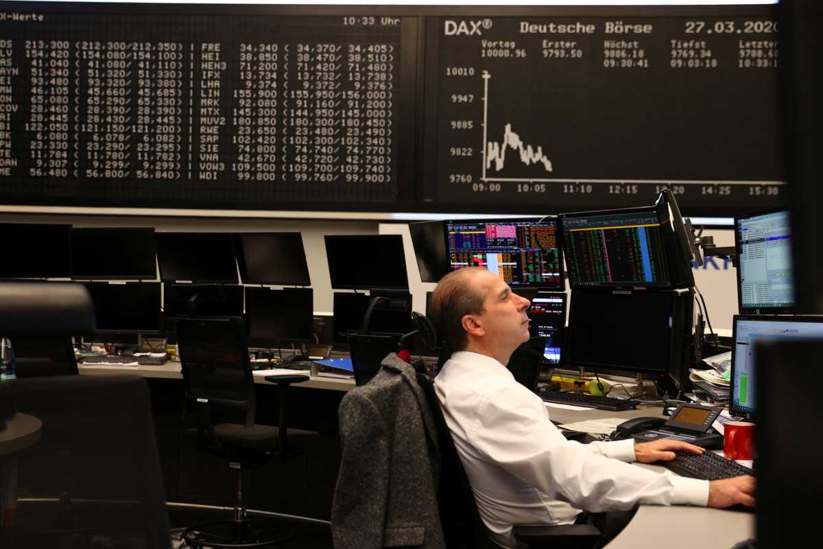 FILE PHOTO – Markets react on coronavirus disease (COVID-19), at stock exchange in Frankfurt