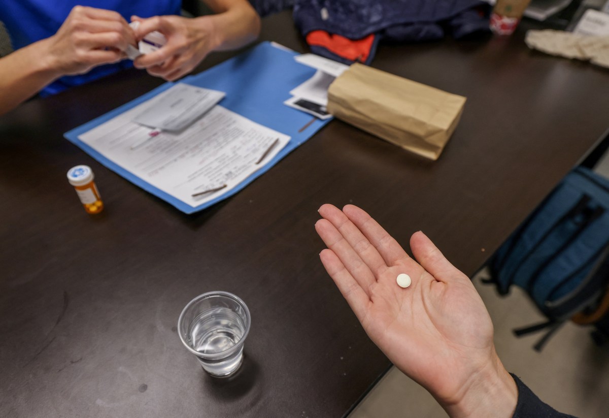 FILE PHOTO: Dr. Shelly Tien hands a patient the initial abortion inducing medication at Trust Women clinic in Oklahoma City