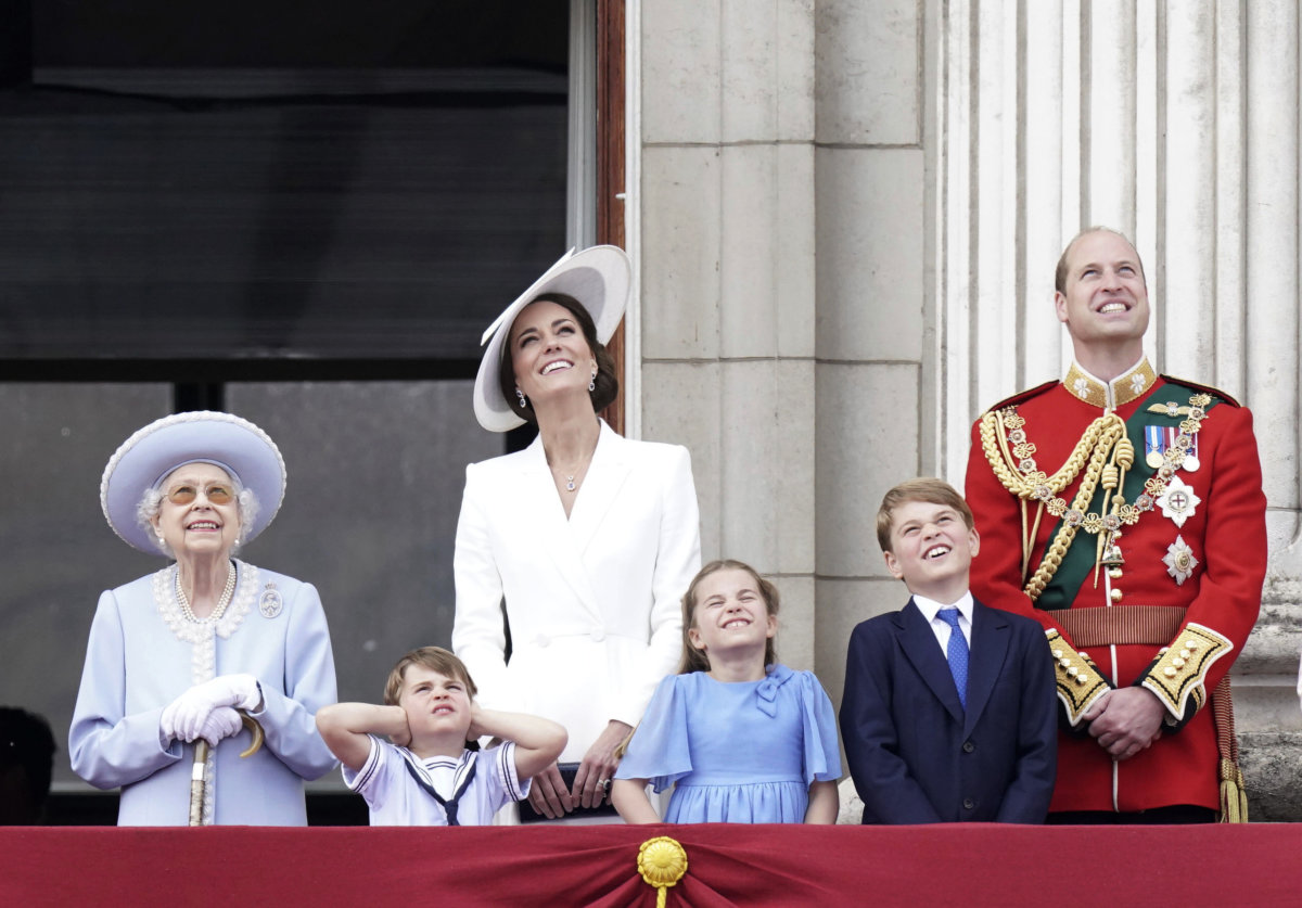 Queen Elizabeth and family members watch ceremonies.