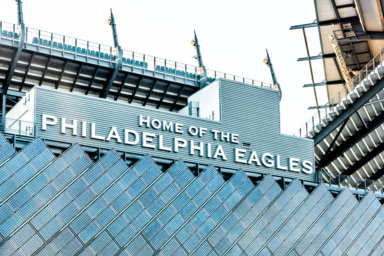 Closeup of sign for Lincoln Financial Field stadium, home of eagles with bleachers seats