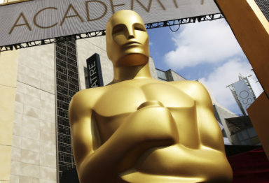 In this Feb. 21, 2015 file photo, an Oscar statue appears outside the Dolby Theatre for the 87th Academy Awards in Los Angeles.