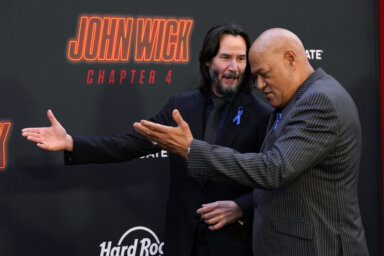 Keanu Reeves, left, and Laurence Fishburne, cast members in "John Wick: Chapter 4,"
