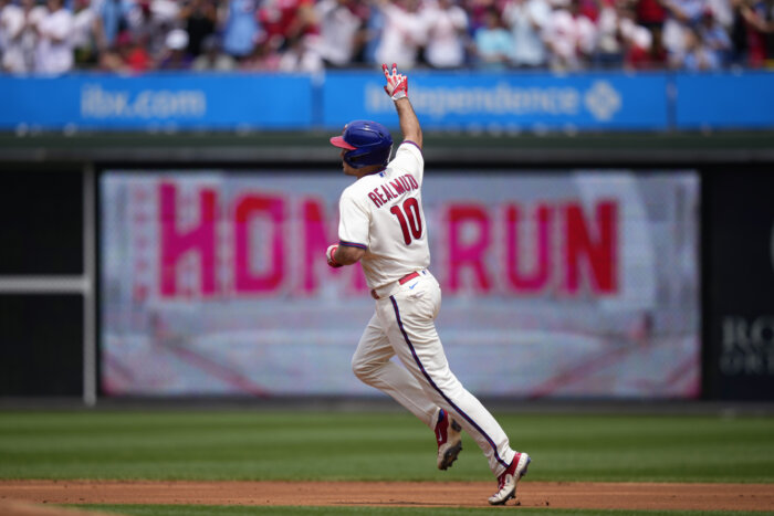 Trea Turner reacts after hitting a grand slam in the eighth inning