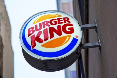 The Burger King logo is displayed on a sign outside a restaurant