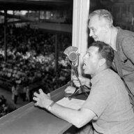 FILE - Baseballer Charlie Grimm,left, deposed by the Chicago Cubs in favor of Gabby Hartnett as manager, takes up new duties as a radio broadcaster at the ball games at Wrigley Field in Chicago, July 25, 1938. He's assisted by Pat Flanagan, a broadcasting colleague. Many baseball fans, especially older ones, originally fell in love with America’s pastime by listening to ballgames on AM radio. But several major automakers are eliminating broadcast AM radio from newer models, prompting lawmakers on Capitol Hill to propose legislation that would prevent the practice for safety and other reasons.