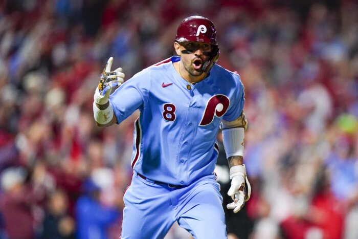 Philadelphia Phillies - Photo of Nick Castellanos wearing the powder blue Phillies  jersey in the dugout.